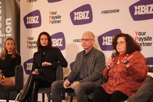 The XBIZ Panel with Ricci Levy on the right, closest to the camera, mid-speech