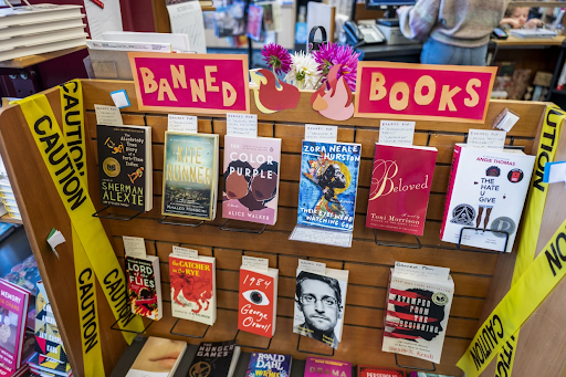 Shelf of books with a sign 