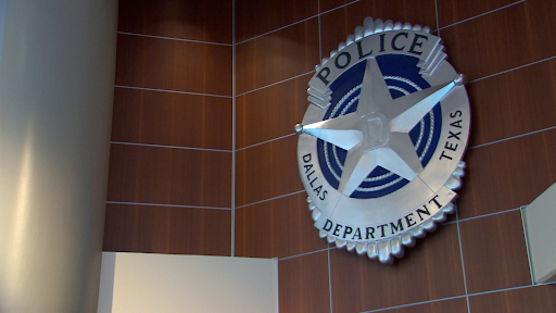 Photo of the Dallas Texas Police Department logo on a sign on the wall