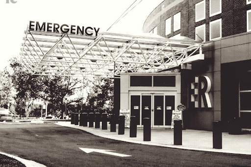 B&W photo of the front of an emergency room at a hospital