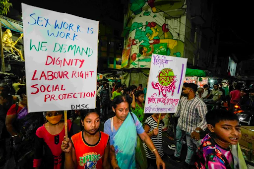 Sex workers and allies at a rally demanding sex work be recognized as work under government labor rules, on the eve of International Labor Day, in Kolkata, India, April 30, 2022. 